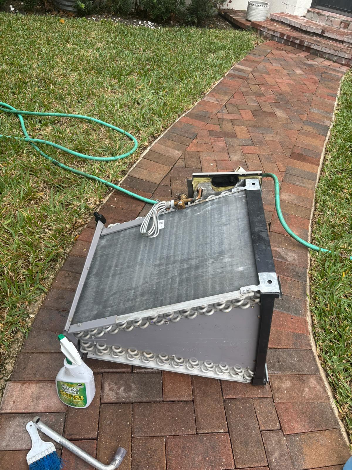 Evaporator coil pulled for deep acid wash cleaning